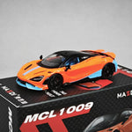 An orange and black die-cast model car with light blue accents, displayed on top of its black retail box. The box features the text 'MAIDI MCL 1009' and 'AEROSTAR'.