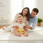 Baby boy wearing a gentleman-inspired romper outfit for a special occasion