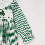 Green and white checkered dress with a shamrock on a light gray background