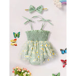 Green baby romper with floral pattern, matching headband, and butterfly decorations on a white background.