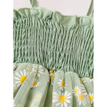 Green dress with floral patterns on a white background
