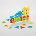 Children building structures with colorful educational blocks