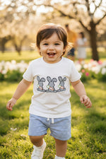 Toddler wearing a cute bunny embroidered T-shirt and striped shorts outfit