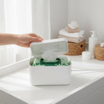 White baby wipe warmer on a nursery changing table for diaper changes