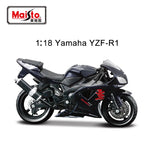 A 1:18 scale model motorcycle of the Yamaha YZF-R1, shown in a black and dark gray livery with red accents, on a white background with the Maiisto brand logo and text overlay.